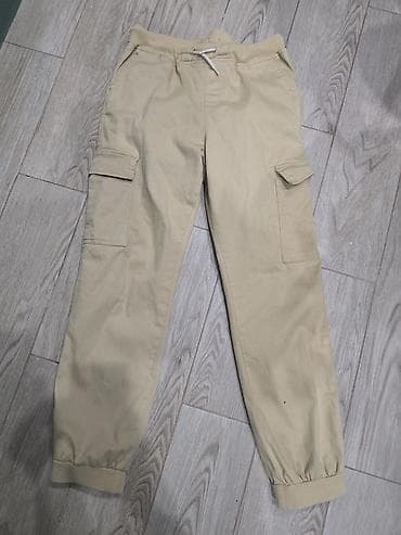 polo şalvar: Uşaq üçün bej rəngli kargo şalvar - Model: kargo/jogger kəsim - Rəng — 1