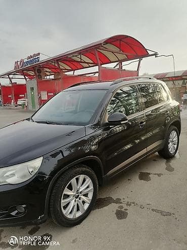 mercedes e 2: Volkswagen Tiguan: 2 l | 2009 il Ofrouder/SUV — 4