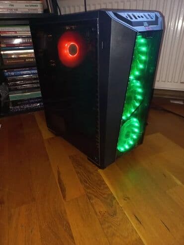 kompyuter hisseleri: Qabaqda üç ədəd mavi işıqlı ventilyatoru olan qara rəngli kompüter — 4