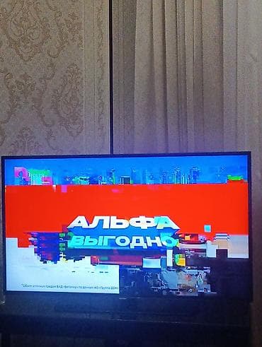 tv box mi: LED televizorsamsunq. - Ekran: təxminən 40–43 düym, nazik çərçivəli — 1