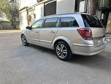 opel astra k: Opel Astra H Caravan (universal), gümüşü rəng. - Kuzov: 5 qapılı — 2