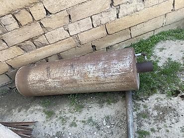 Metaldan hazırlanmış iri silindrik soba/katel korpusu (baca çıxışı və