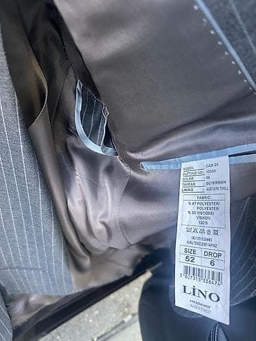 paltar kisi: Klassik kişi kostyumu – boz rəngdə, incə ağ şaquli zolaqlı “pinstripe” — 5