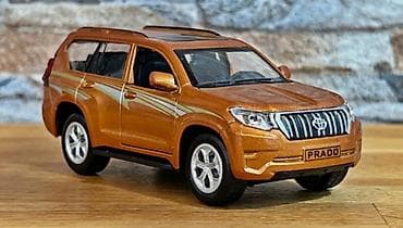 qedim pullar aliram: Metalik narıncı rəngdə Land Cruiser Prado mini model avtomobil — 3