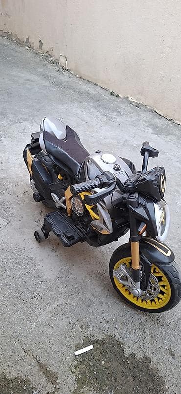 oyuncaq 28may: Uşaq üçün elektrik motosiklet. Boz, qara və sarı rəng — 1