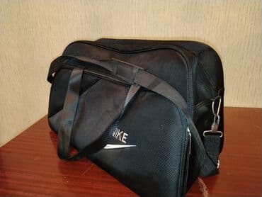 wolt cantası: Uniseks istifadə üçün nəzərdə tutulmuş qara rəngli idman çantası — 1