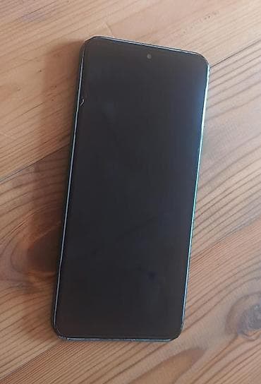 Məhsul: Yaşıl rəngli smartfon + tematik qoruyucu örtük Təsvir: - Arxa — 2