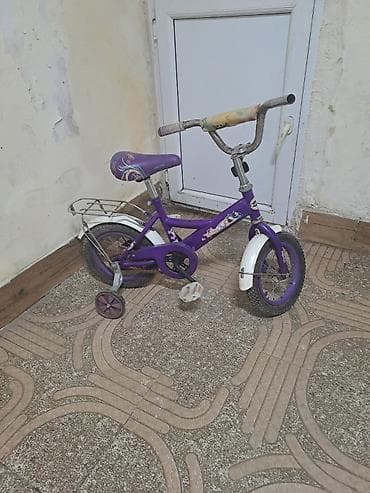 Uşaq velosipedi – bənövşəyi rəngdə, dekor naxışlı. Xüsusiyyətlər: - — 2