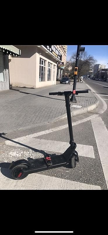 elektrikli skuturlar: Elektrik skuter – qara rəng, yığcam və şəhər üçün ideal — 5