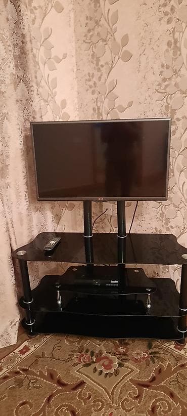 divar kitab refleri: LG televizor + şüşə TV stendi (dəst) Məhsulun tərkibi: - LG LED — 2