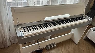 adapt: Medeli rəqəmsal piano – elegant ağ/gümüş korpus və qapaqlı konsol — 1