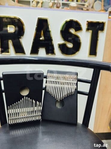 dominos sumqayit: Kalimba Black Rast musiqi alətləri mağazalar şəbəkəsi 3 ünvanda — 1