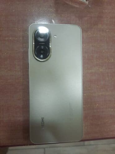 Volkswagen: Redmi smartfon xx - Model: Redmi (arxa qapaqda “REDMI” loqosu) — 2