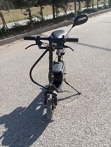 e39 guzgu: Elektrikli skuter. 10 Ah. Tam doldurma ilə 20-25 km. Sürət təxminən 20 — 5