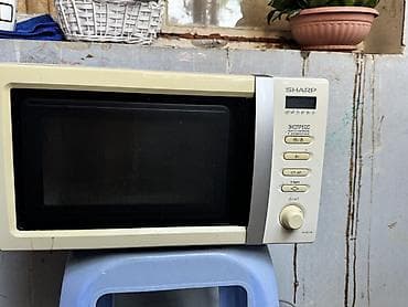 su krant: SHARP R-2371K mikrodalğalı soba - Kompakt ölçülü, ön hissədə şüşə — 1