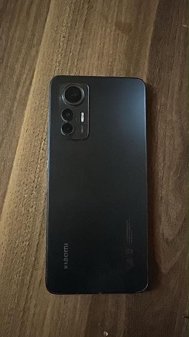 телефон fly cumulus 1: Xiaomi 12, цвет - Черный, 
 Отпечаток пальца — 1