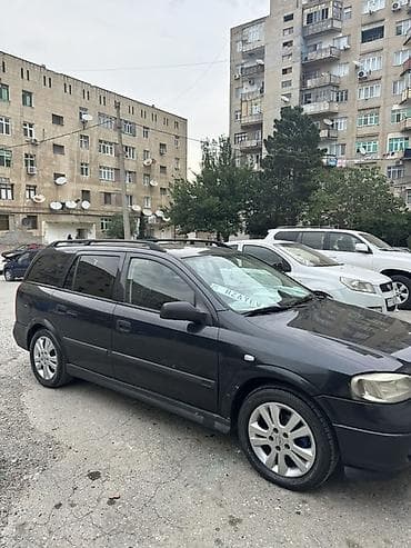prius qapi: Opel Astra Caravan (Universal) – qara rəng Xüsusiyyətlər: - Kuzov — 3