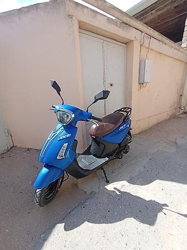 prado tekerleri type 1: Məhsul: JOG model skuter (mavi rəng) Xüsusiyyətlər: - Şəhər içi rahat — 2