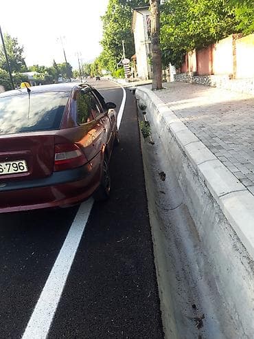 opel omega b: Opel Vectra sedan – vişnə rəngi, 4 qapı, qara disklər, tonlu şüşələr — 7