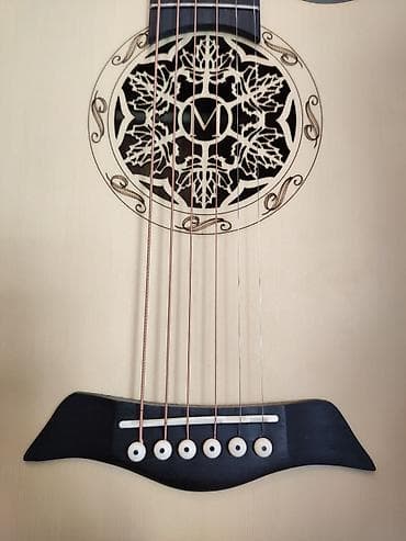 Akustik gitaralar: Elektro akustik gitara Model:Smiger LG-07 Üst: Şam ağacı Qol: Gül — 2