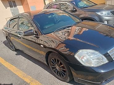 man sat: Nissan Teana – qara rəngli, geniş və komfortlu sedan. Xüsusiyyətlər — 2