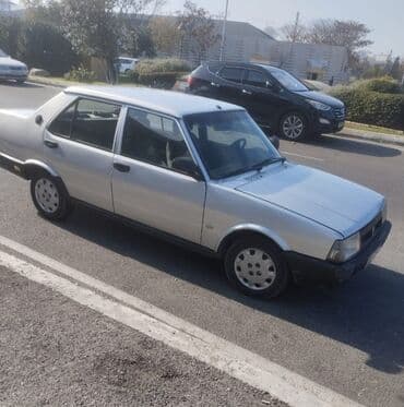 tofaş satış: Tofaş Şahin/Doğan (sedan) – gümüşü rəng Xüsusiyyətlər: - Kuzov: 4 — 10