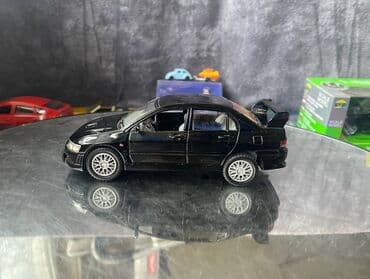 maşın modeli: Коллекционная модель Mitsubishi Lancer Evolution VII black 2002 — 2