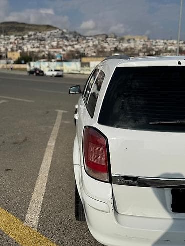 Opel Astra Caravan (Universal) - Kuzzov: universal (Caravan), ağ rəng