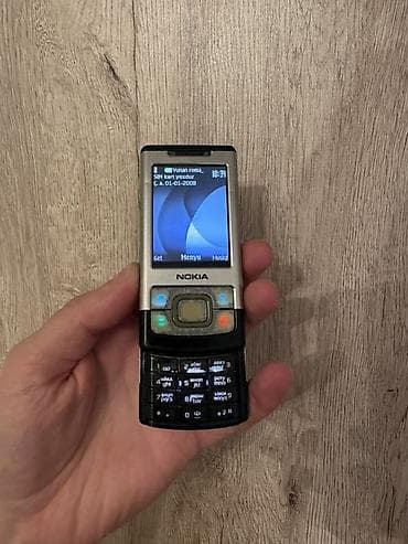 philips xenium 9@9d: Nokia rəng - Gümüşü, Düyməli — 1