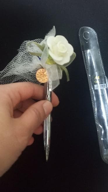 korpu kran: Dekorativ qələm – gümüşü rəngli, döndərmə mexanizmi ilə. Üst hissəsi — 1