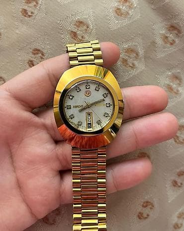 qol sahatları: Rado kişi qol saatı - Korpus: qızılı tonlarda oval/padşah formalı — 1