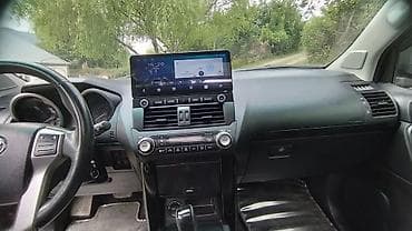 Toyota Land Cruiser Prado: 2.7 л | 2014 г. Внедорожник — 7