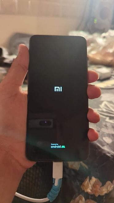 nar operator nomresi: Xiaomi Mi 9, 64 GB, rəng - Göy, 
 Barmaq izi, Simsiz şarj, Face ID — 7