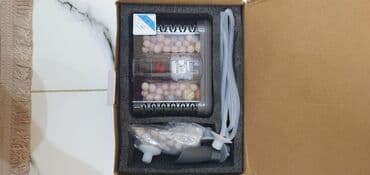 ag dovsan: Ağ rəngli silindrik korpusa malik akvarium xarici filtri. Qablaşdırma — 7