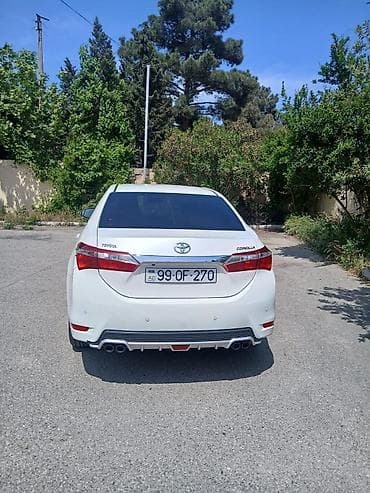 Toyota Corolla: 1.6 l | 2014 il Sedan — 4