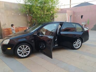 oturucu: Volkswagen Jetta: 2 l | 2009 il Sedan — 5