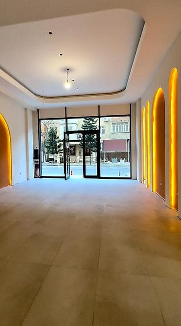 aşağda: Kooperasiya universitetinin yanında, əsas yola baxan, ümumi sahəsi 103 — 3