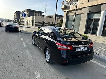 Nissan Sentra: 1.6 л | 2014 г. Седан — 2