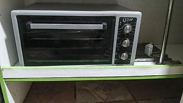 Ellay mini elektrik sobası. Şüşə qapılı kompakt sobadır, ön