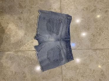 eclat de lune: Məhsul: Qadın denim şort - Model: Açıq mavi, “distressed” effektli — 1