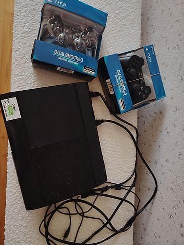var box: Sony PlayStation 3 Super Slim konsolu + 2 ədəd DualShock 3 simsiz pult — 1