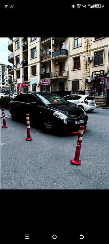 Avtomobil satışı: Nissan Tiida sedan – qara rəng, şəhər üçün qənaətcil və rahat ailə — 1