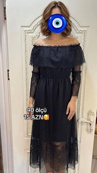 Qara rəngli, açıq çiyinli zərif don. Üst hissə atlas effektli tül ilə