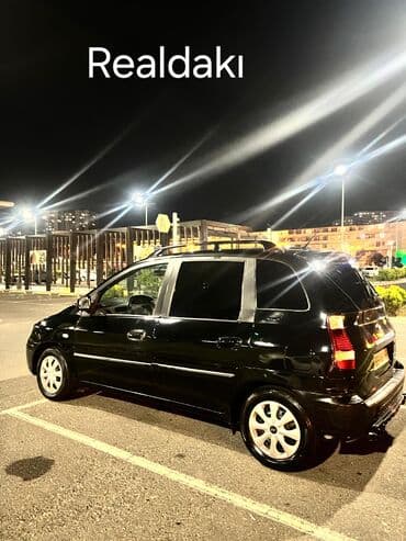 багажник на крышу авто: Hyundai Matrix avtomobili. Qara rəngli bu model, funksional dam — 3