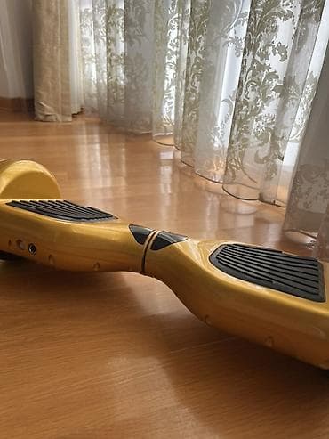 Elektrik nəqliyyatı: Qızılı rəngdə hoverboard (özünü tarazlayan skuter) Bele istemir amma — 1