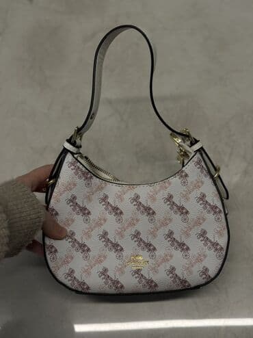 Çiyin çantası, Məşqçi