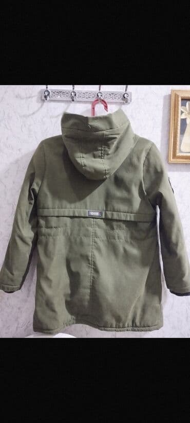 uşaqlar üçün xəz papaqlar: Uşaq üçün kapüşonlu parkа – yaşıl (xa ki) rəngdə. Xüsusiyyətlər: - — 2