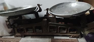 Qədimi sivetdən qalma daş tərəzi. Qədimi şirəcəkən maşın