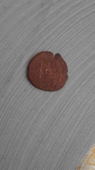 CD, DVD disklər və kassetlər: Məhsul: Köhnə mis sikkə (4 ədəd) Təsvir: - Material: mis - Say: 4 — 10