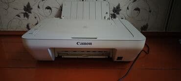 en ucuz kondisionerler: Ağ rəngdə olan Canon printeri. Bu, evdə və ya kiçik ofisdə istifadə — 2